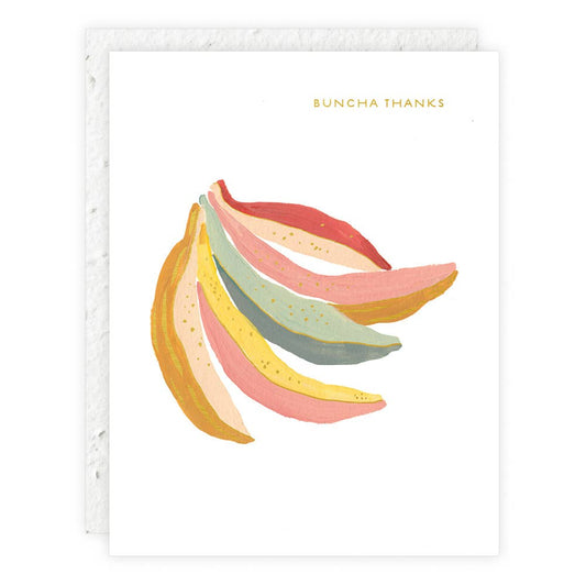 Mini greeting card with a drawing of colorful bananas and the text 'Buncha Thanks' on it, with foil details on the card.