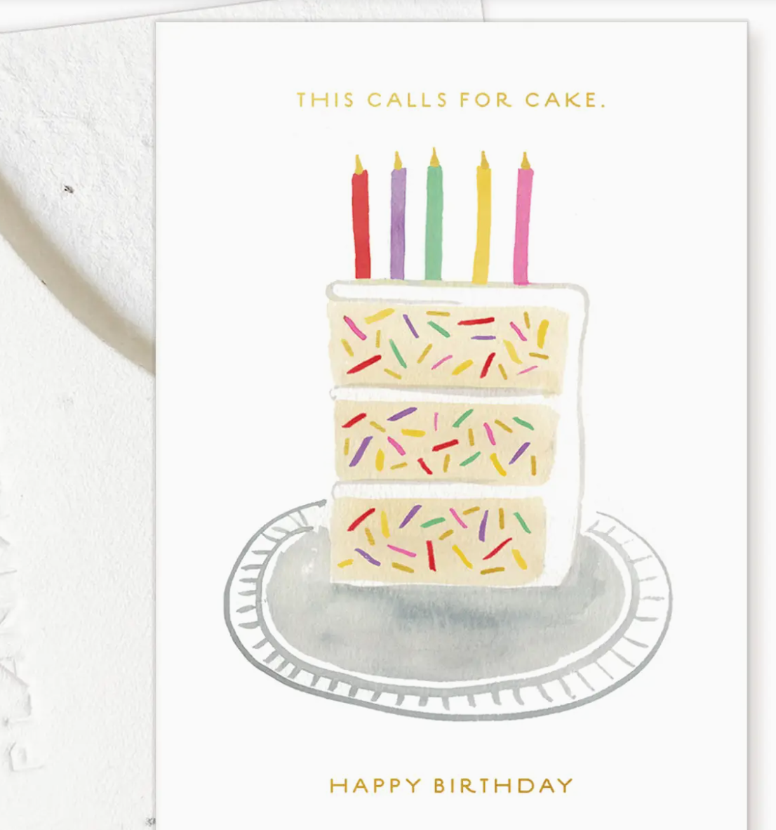 Birthday card with a cake illustration and colorful candles on a white background.